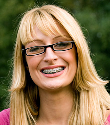 photo of smiling woman with braces